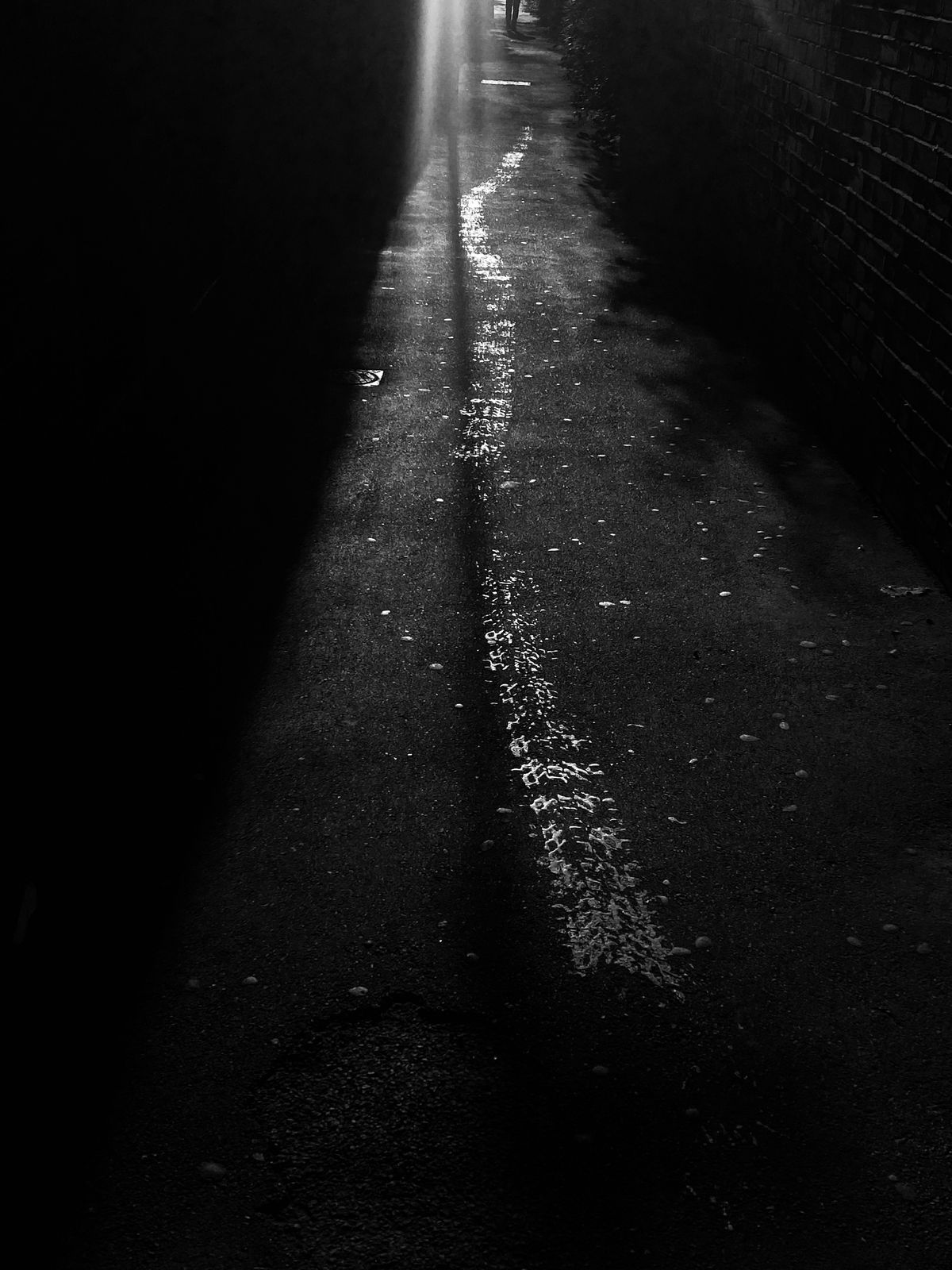 Light tracing across train tracks at night